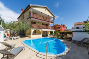 Family friendly apartments with a swimming pool Novigrad - 11242